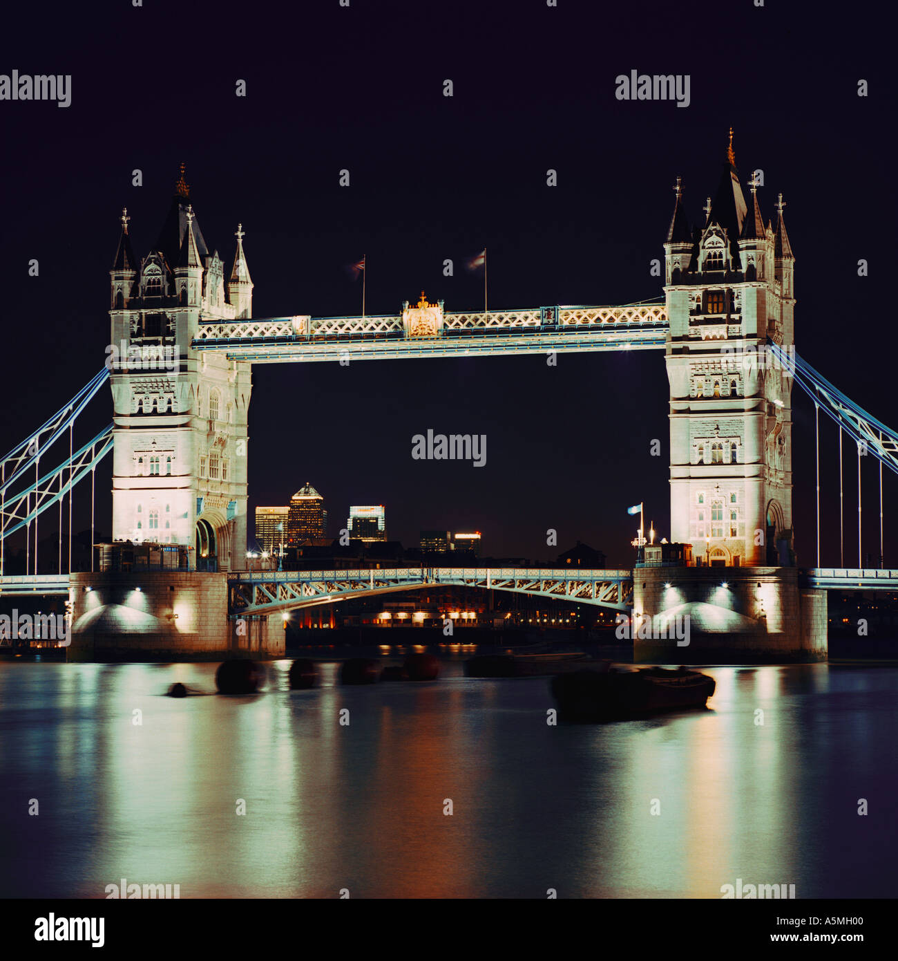 night shot of Tower Bridge London inc Canary Wharf River Thames Stock Photo