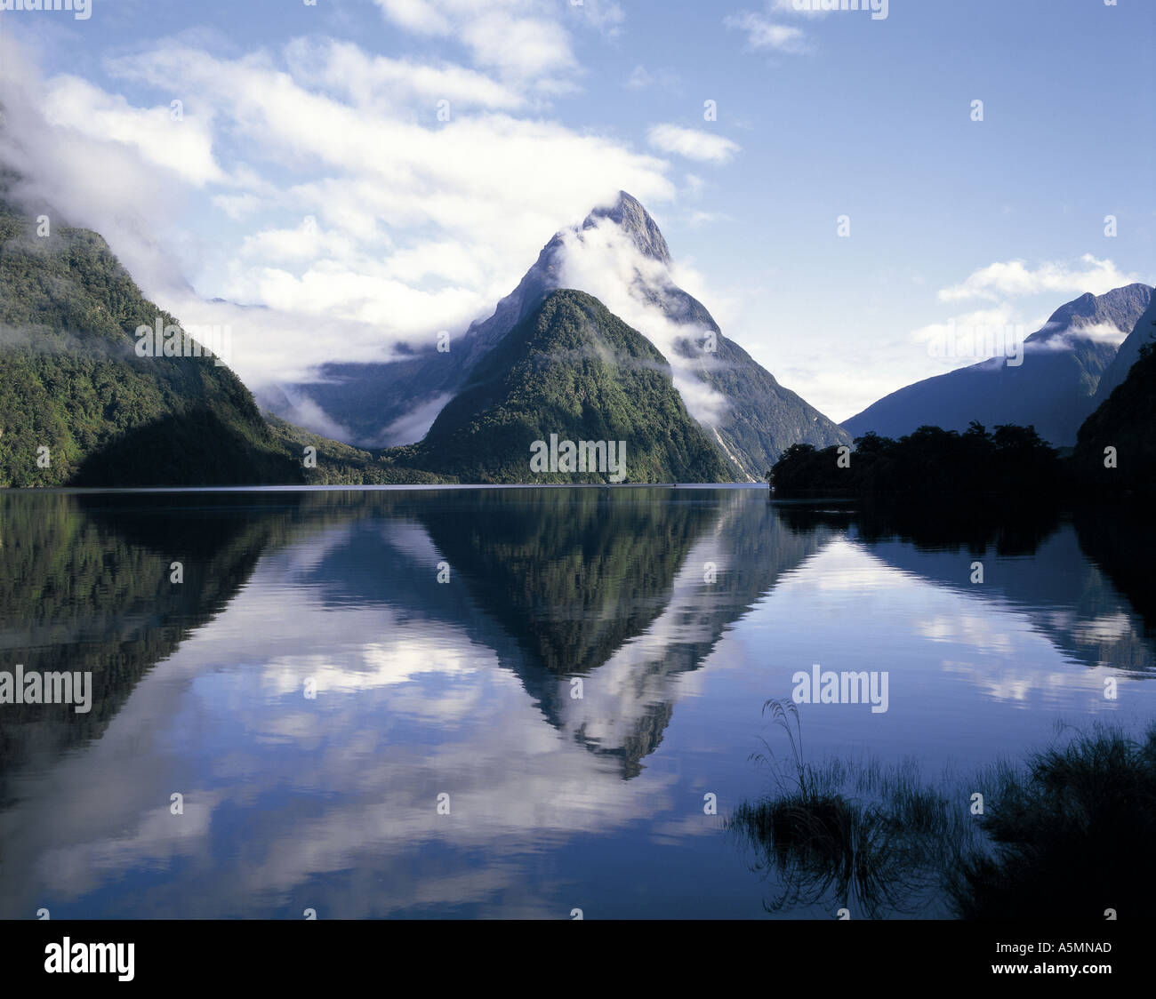 Mitre Peak reflected in Milford Sound South Island New Zealand Stock Photo