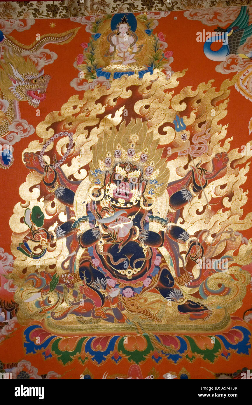 Tibetan buddhist art gold silk tangka painting of Wrathful deity Mahakala Stock Photo