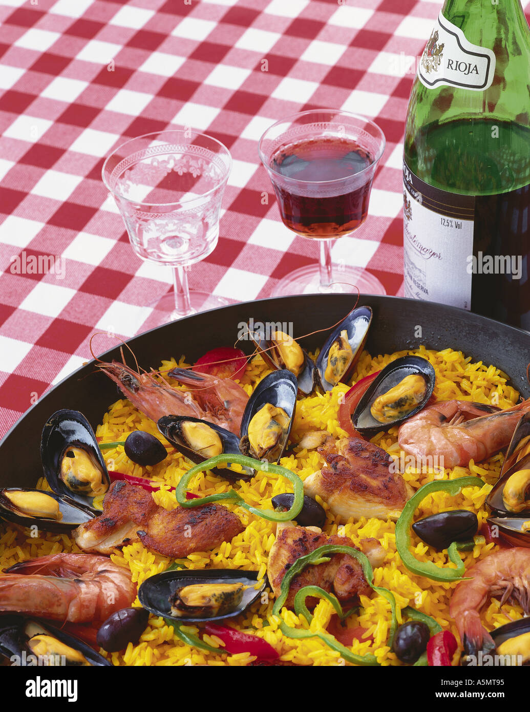 Spanish paella and red wine Stock Photo Alamy