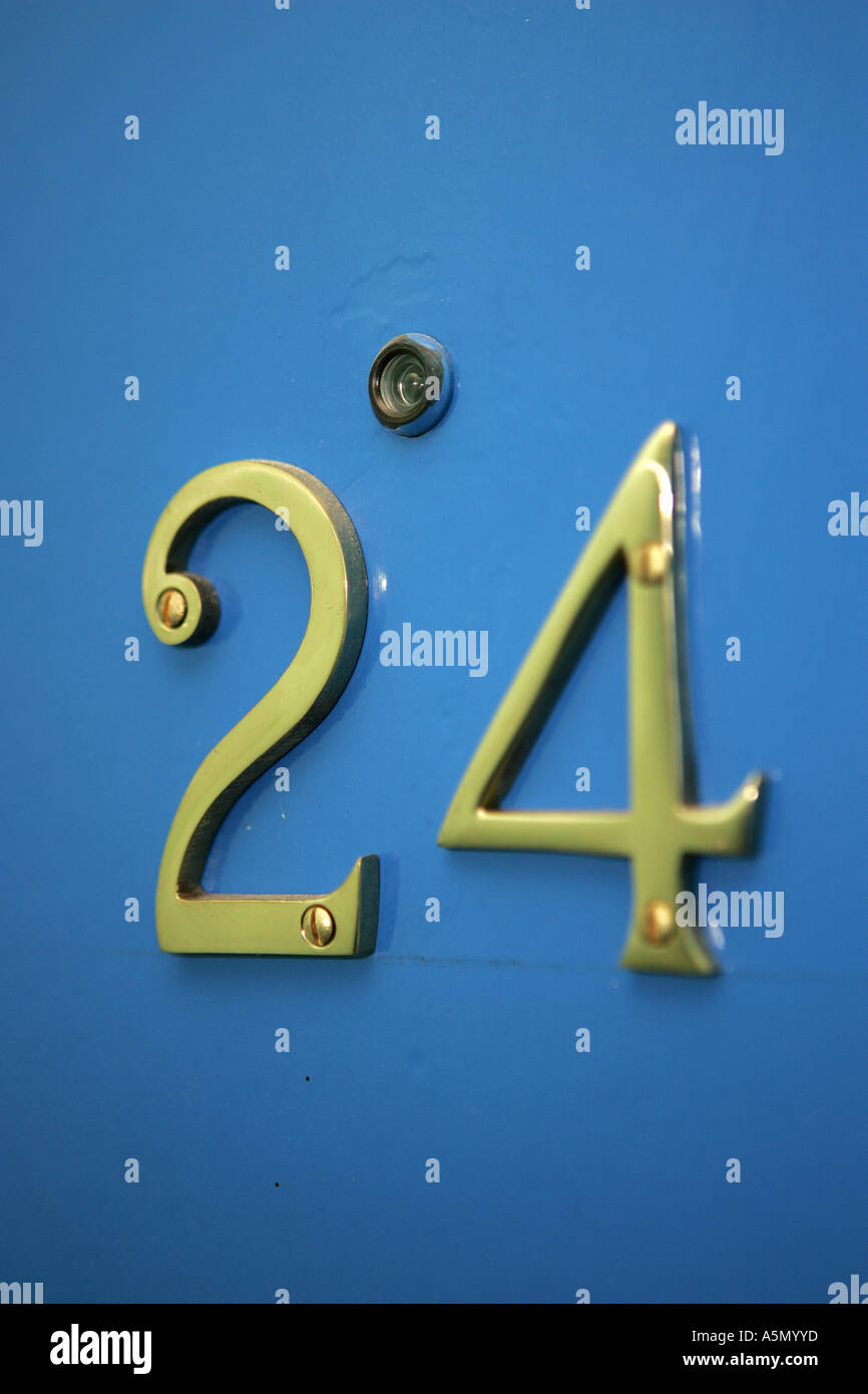 DOOR NUMBERS ON A BLUE DOOR WITH  PEEPHOLE Stock Photo