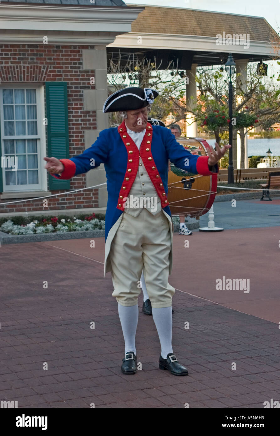 Costumed Fife and Drum Corps leader bowing after performance in front