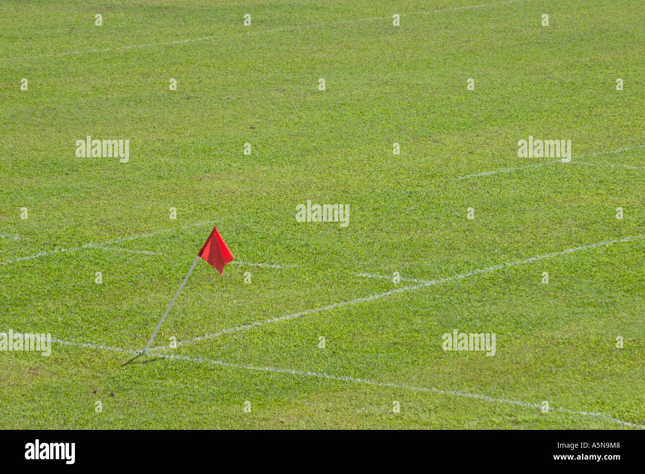 red flag on a field Stock Photo - Alamy