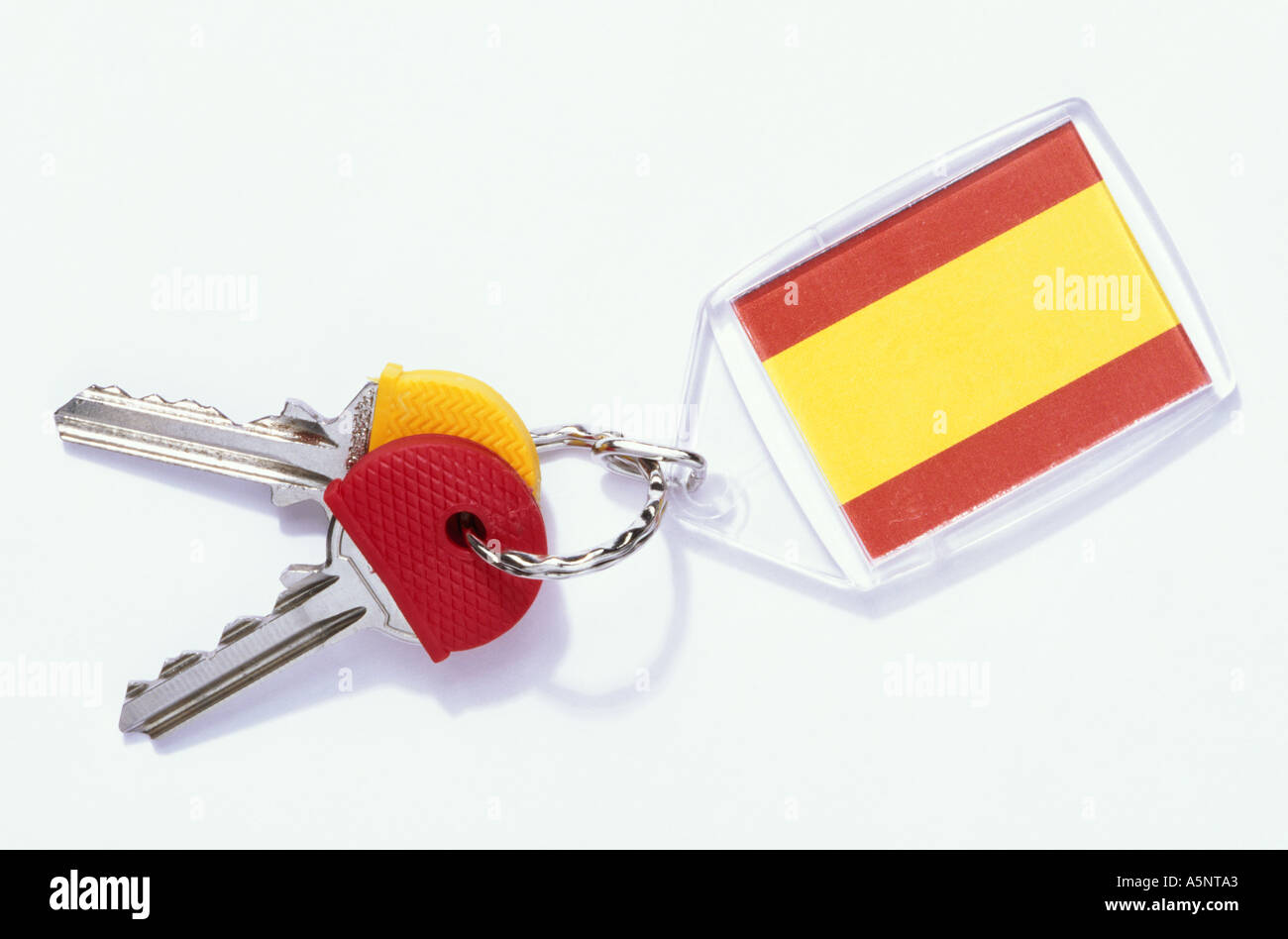 Keys on a red and yellow Spanish key ring Stock Photo Alamy