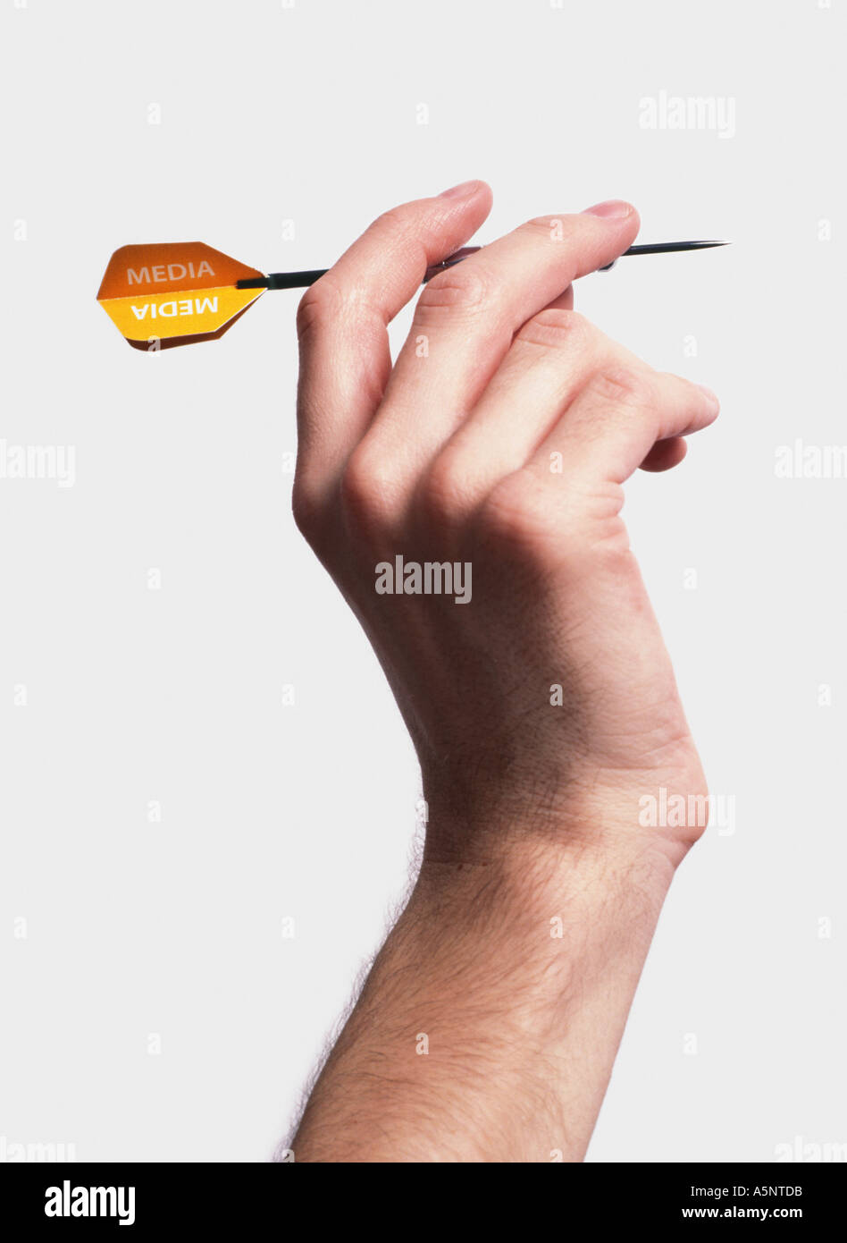 A hand holding a dart Stock Photo Alamy