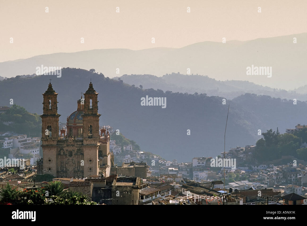 Church of Santa Prisca, designed by Miguel Custodio Duran, at sunset, view from Church of Ojeda, Taxco, Mexico Stock Photo