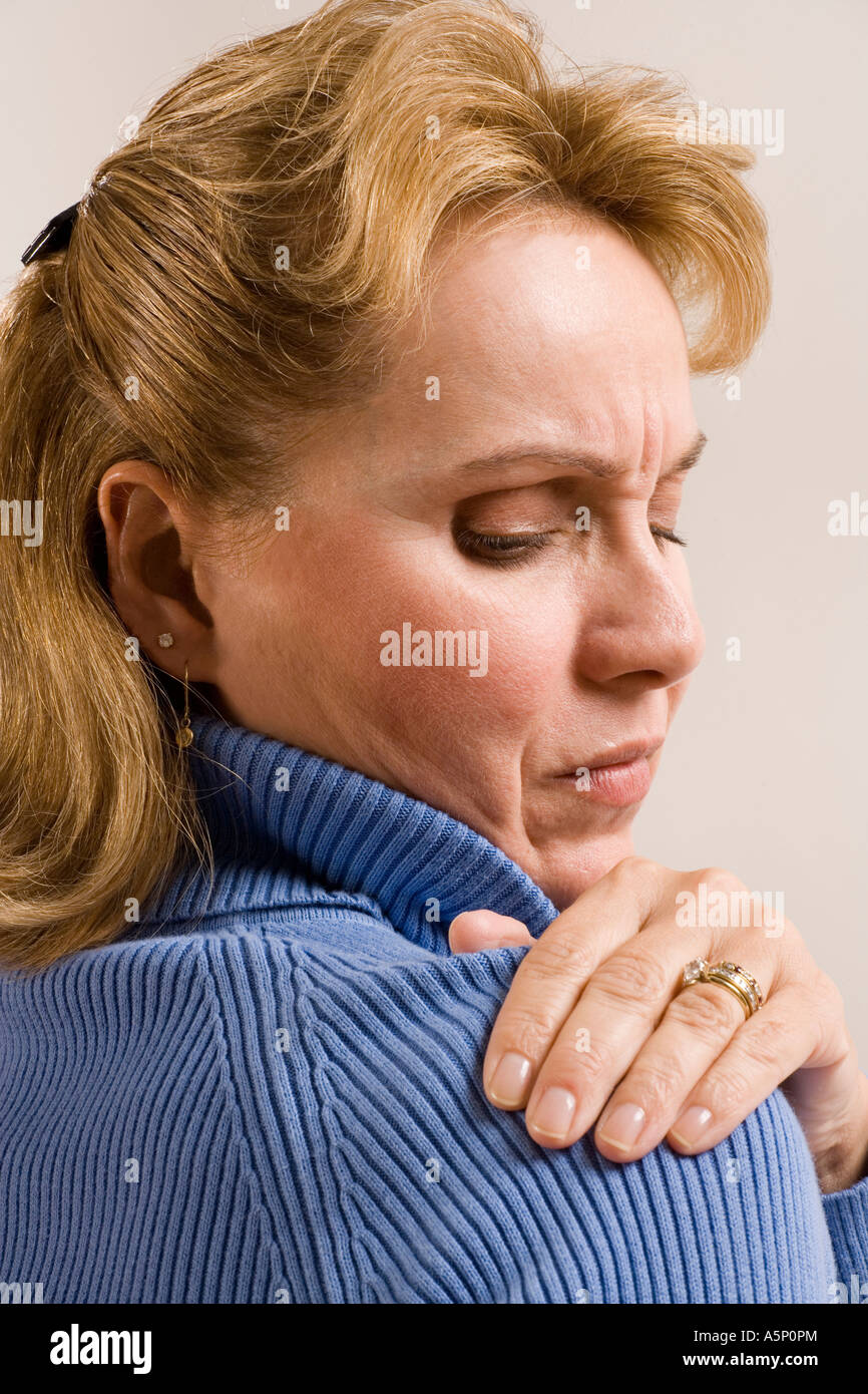 Woman with sore shoulder Stock Photo Alamy
