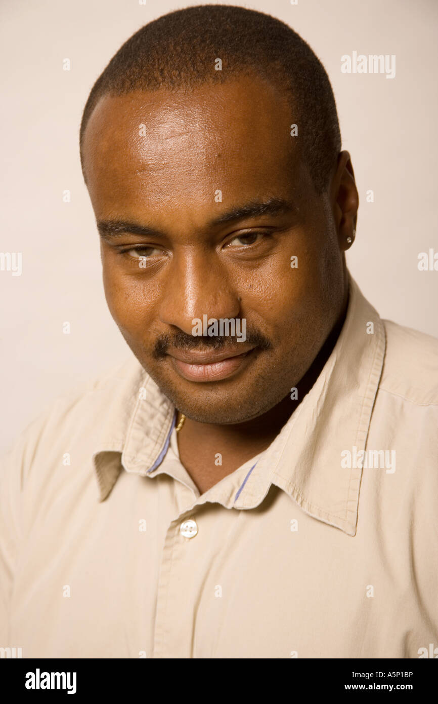 Studio portrait of a young black man Stock Photo - Alamy