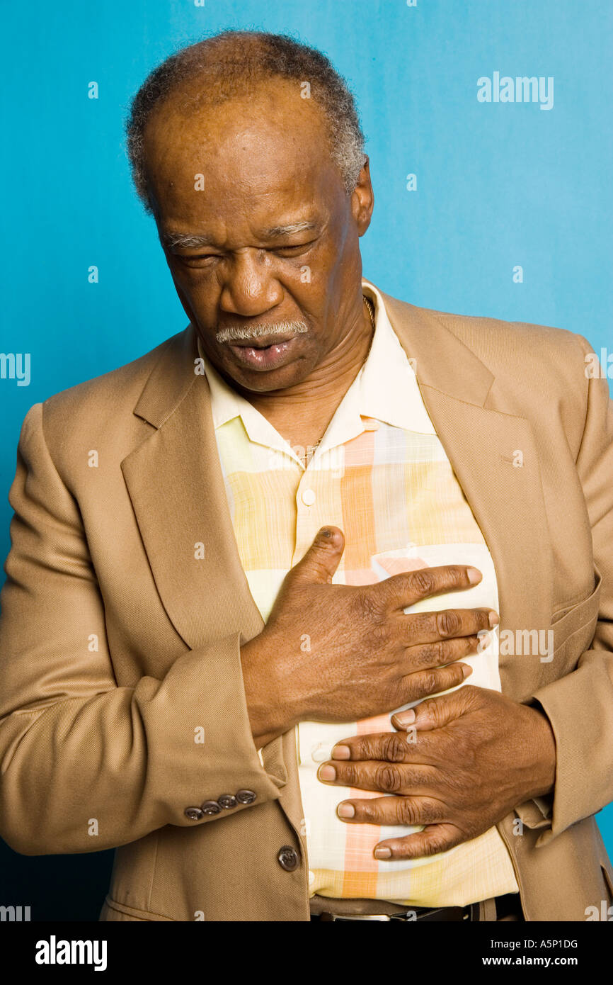 Adult male having chest pains. Possible heart attack. Stock Photo