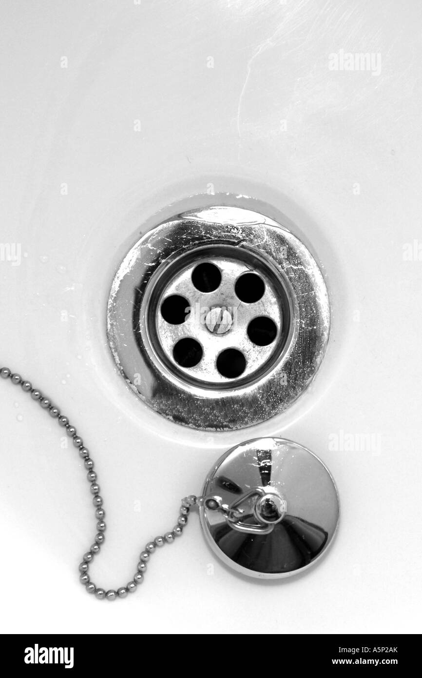 Sink Plughole and stopper on a chain. Stock Photo