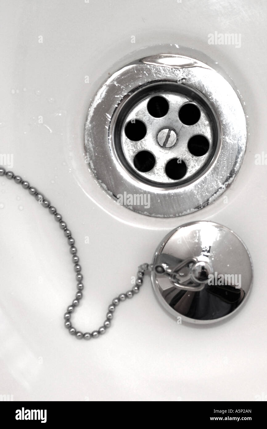 Sink Plughole and stopper on a chain. Stock Photo