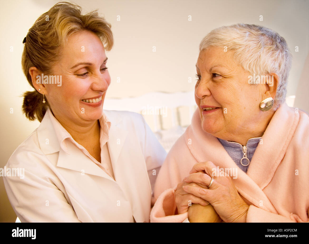 Home care skilled nurse visits elderly patient at home. Stock Photo