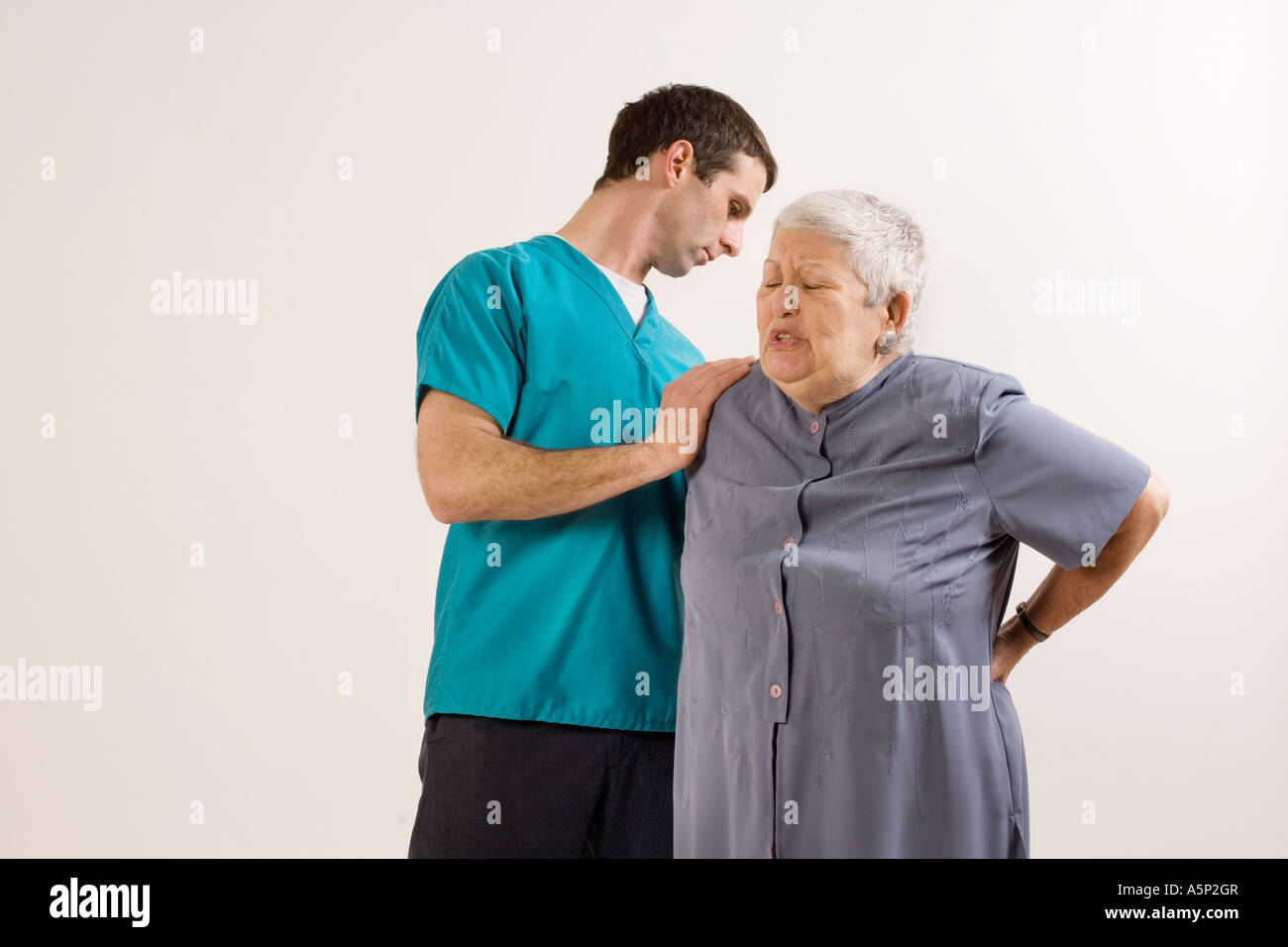 Lower back pain elderly woman hi-res stock photography and images