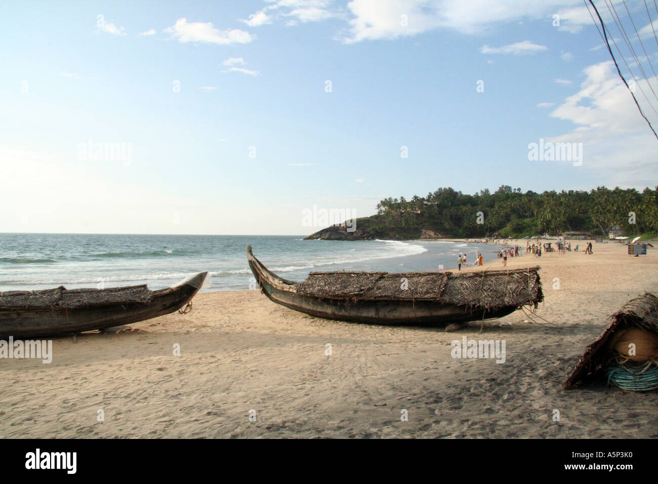 Traditional fishing boats on Kovalam Beach, Kerela, India Stock Photo