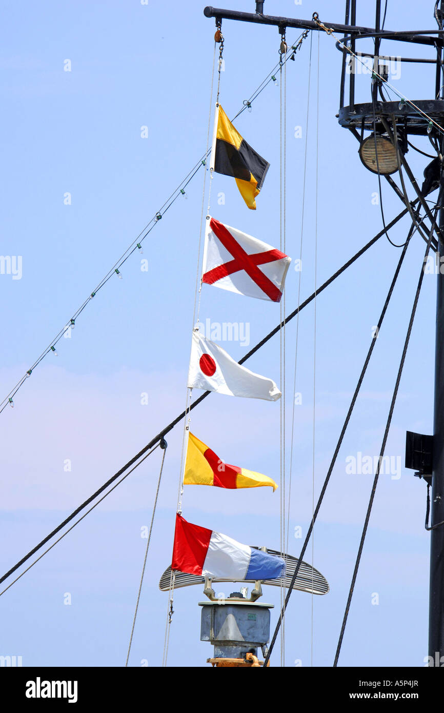 Navy Message flags flying from a ships mast. Stock Photo