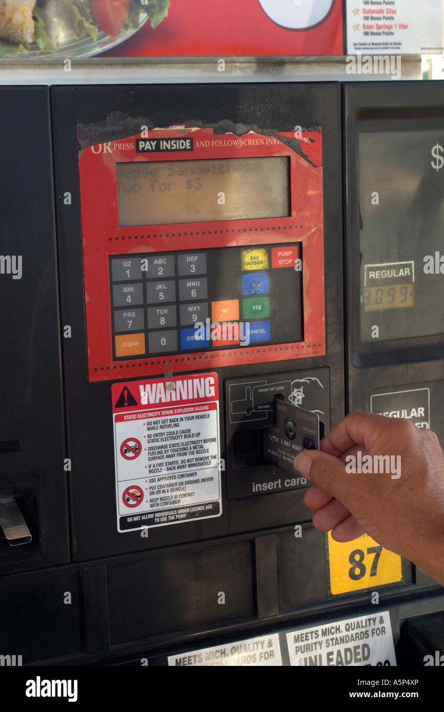 Swiping card at gas pump hires stock photography and images Alamy