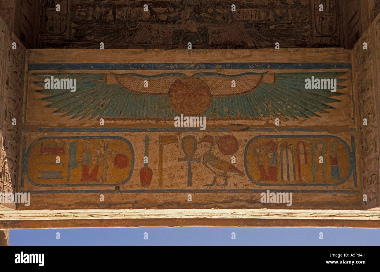 Medinet Habu, polychrome bas-relief depicting the winged solar disc, Luxor, Egypt Stock Photo