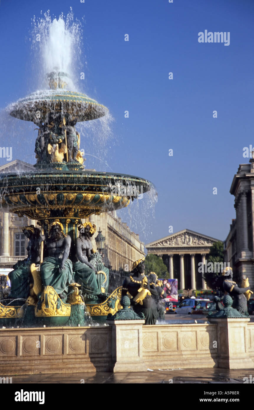 Fountain in the Place de la Concorde with views through to the Eglise de la Madeleine Stock Photo