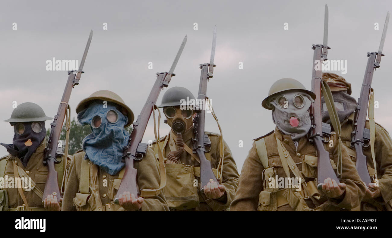 WW1 British soldiers in gas masks spanning developments in design Stock Photo