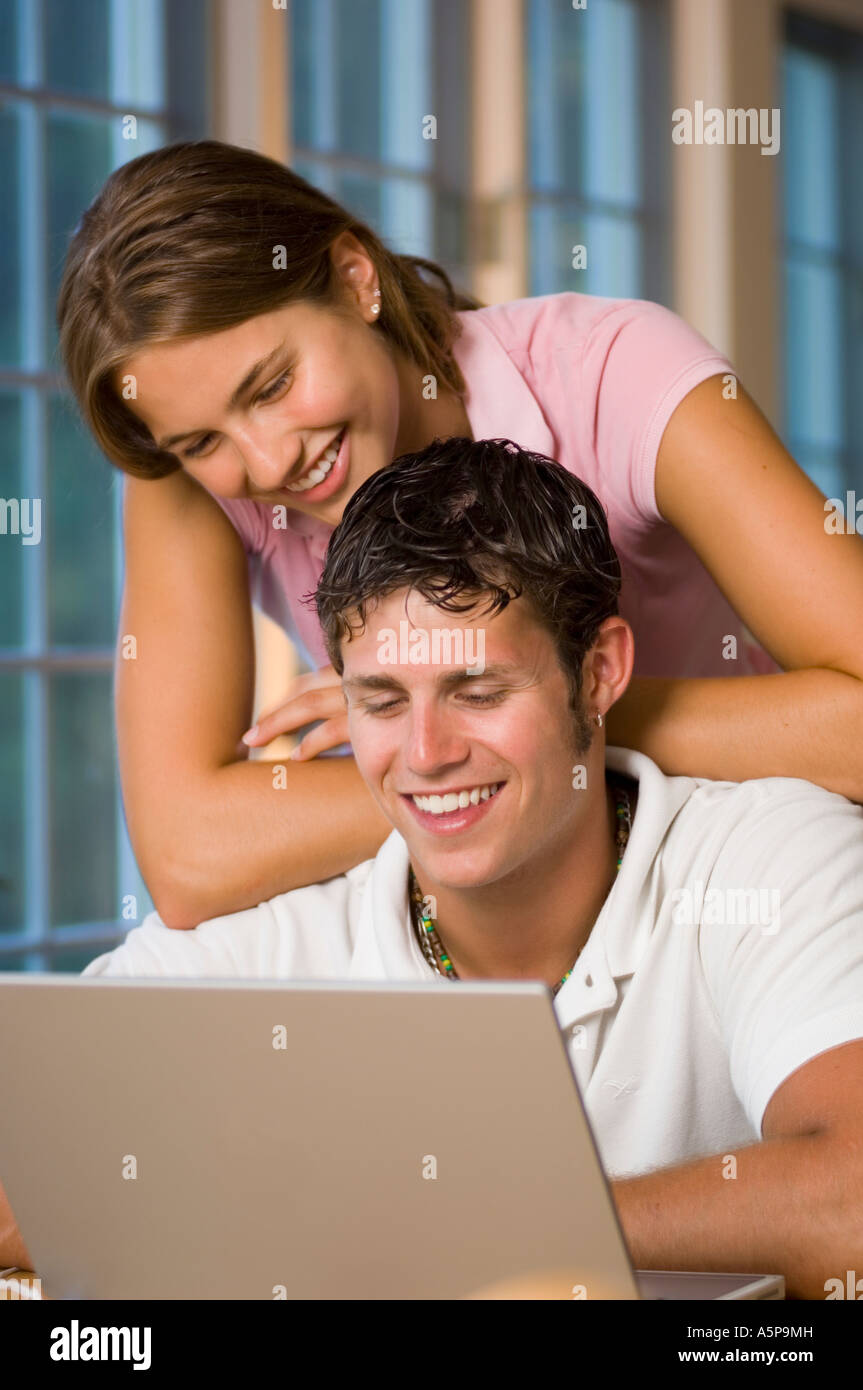 Teenage boy and girl doing homework on computer. Stock Photo