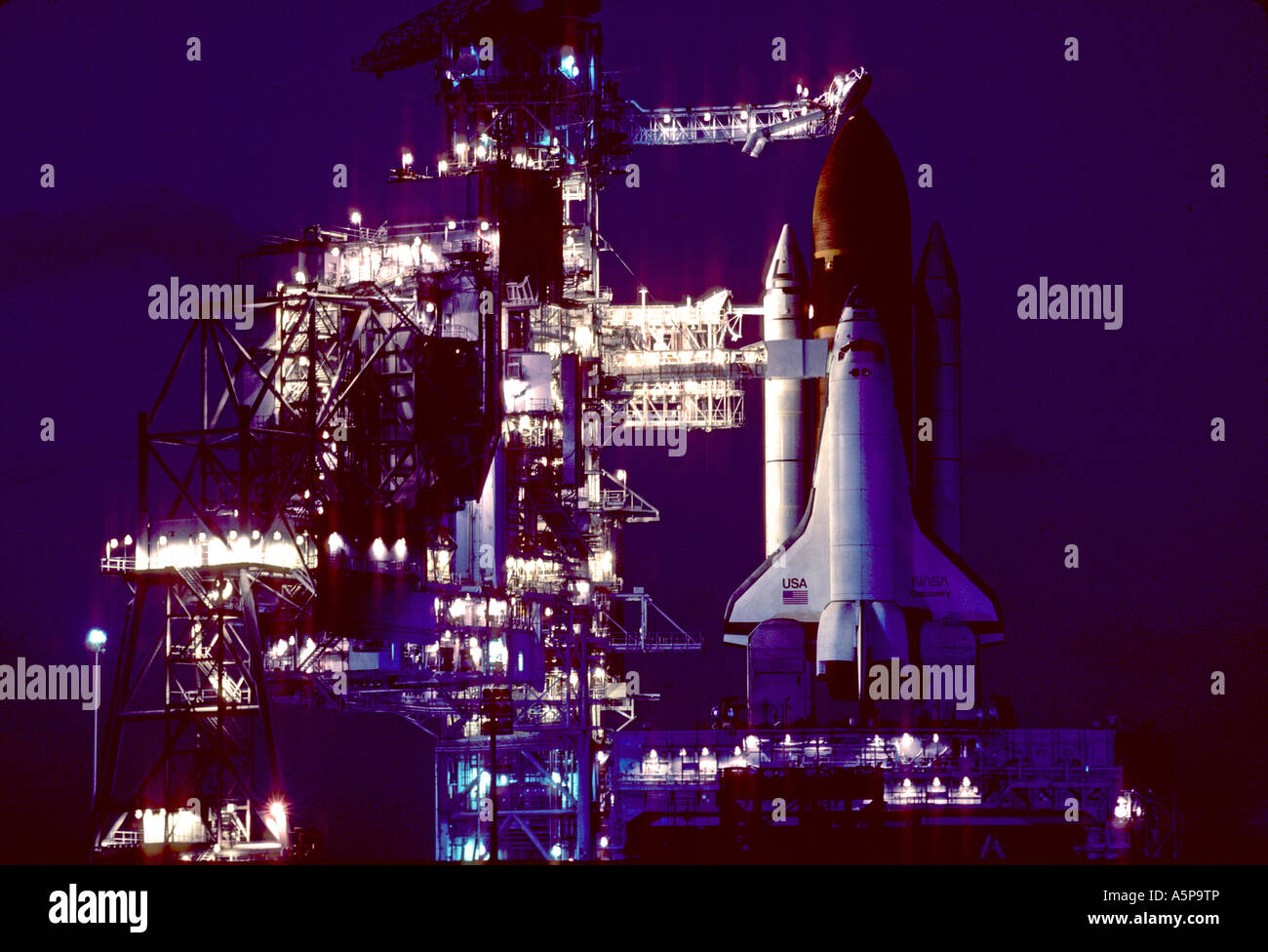 Night view of NASA space shuttle on launch pad, Cape Kennedy, Florida