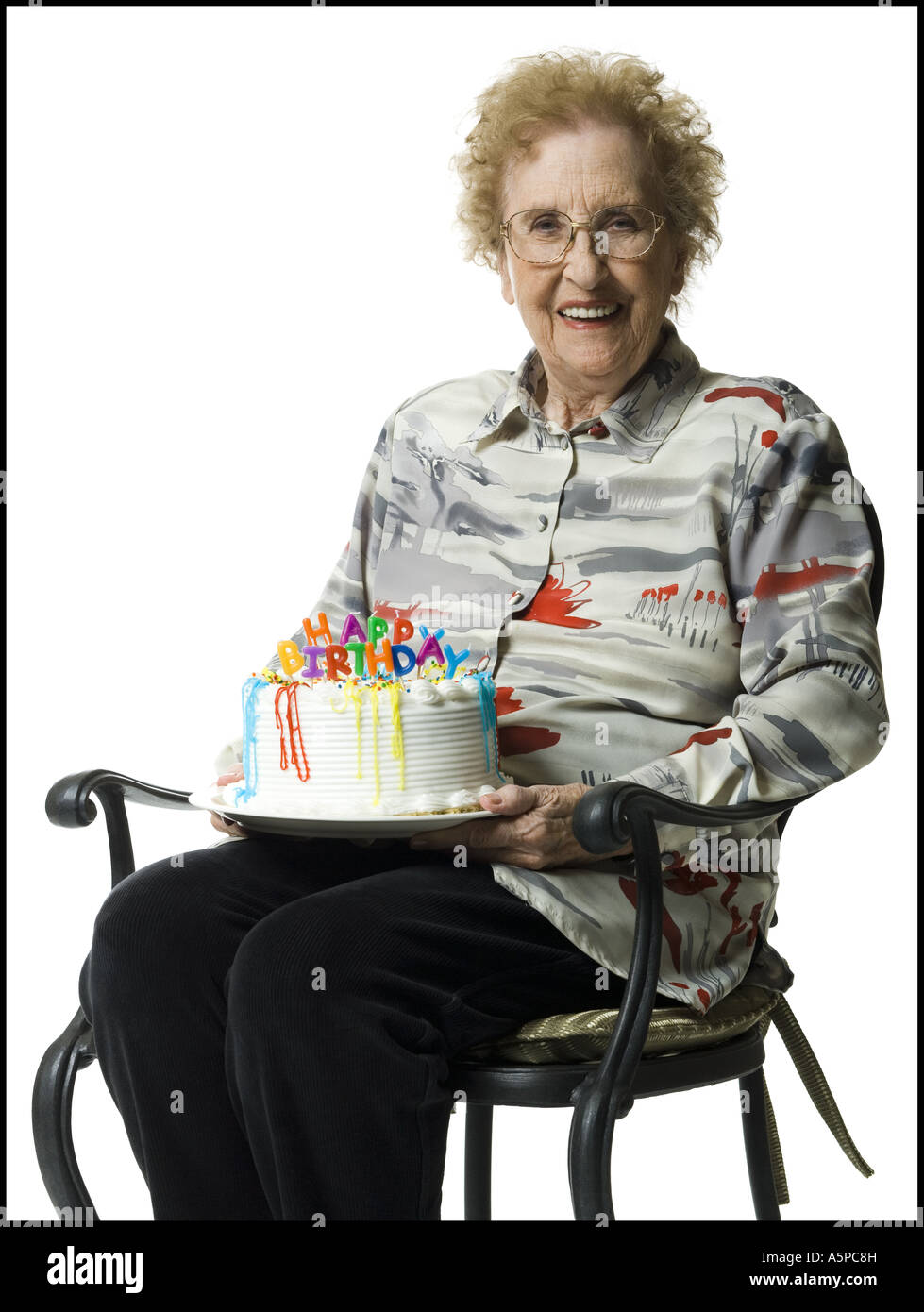 Elderly woman on her birthday with cake Stock Photo Alamy