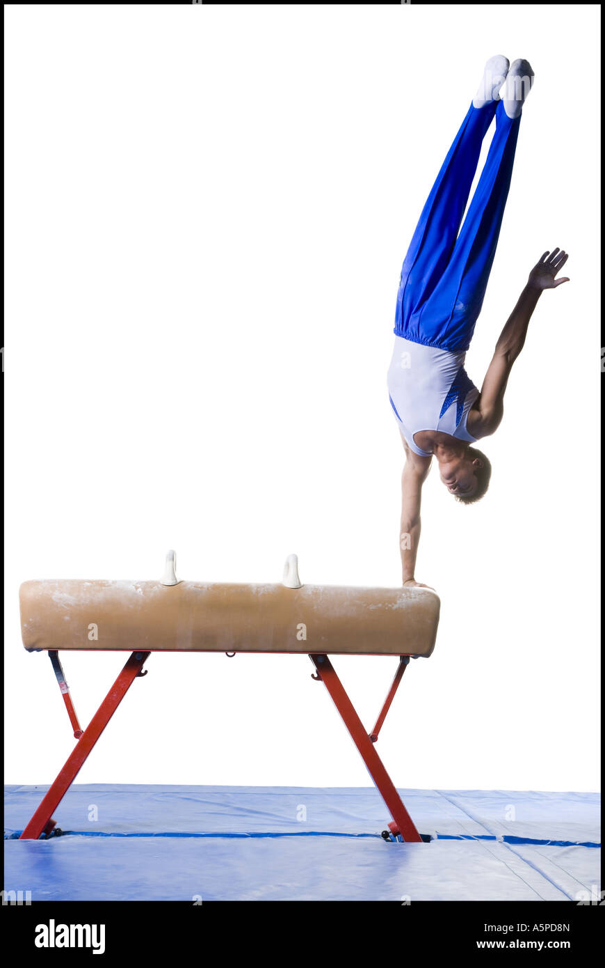 Male gymnast performing routines on vaulting horse Stock Photo Alamy