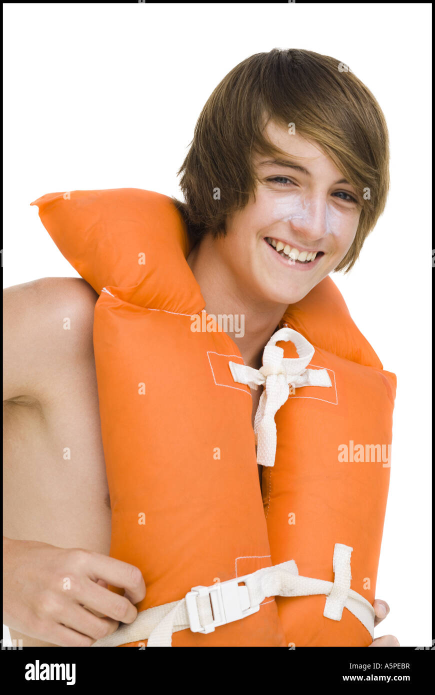 Boy in swim trunks with life vest Stock Photo Alamy