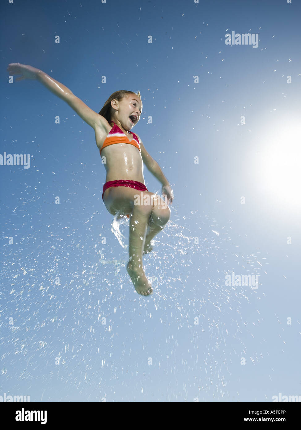Young girl jumping in water Stock Photo Alamy