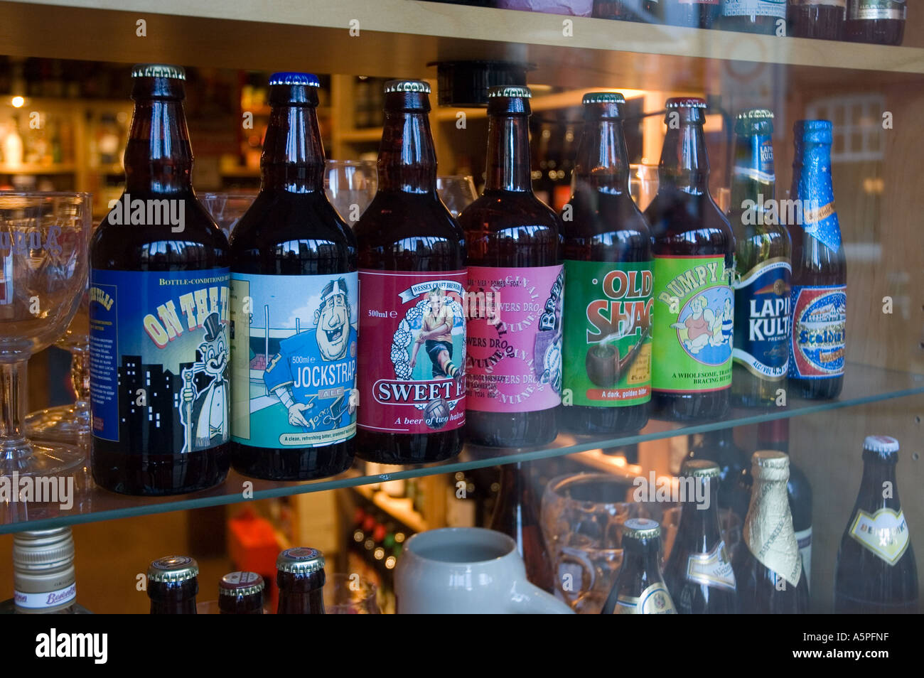 Bottles of beer in specialist beer shop Stock Photo Alamy