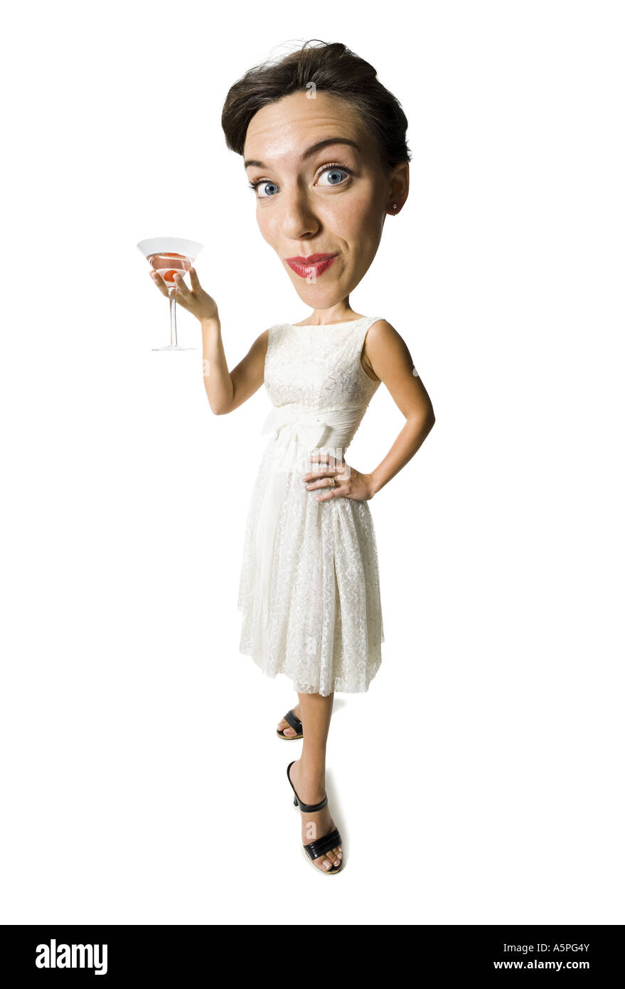Woman in white dress holding martini glass Stock Photo Alamy