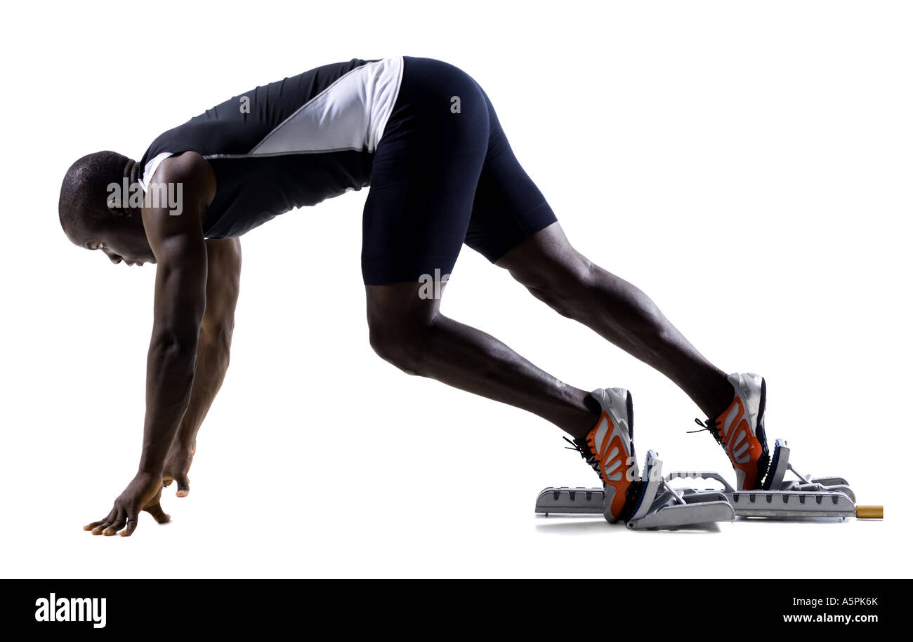 Track runner in starting position ready to race Stock Photo Alamy