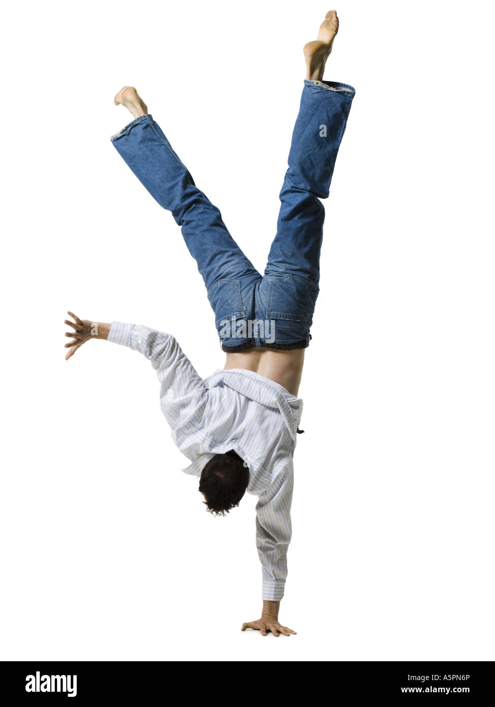 Man doing a one armed handstand Stock Photo