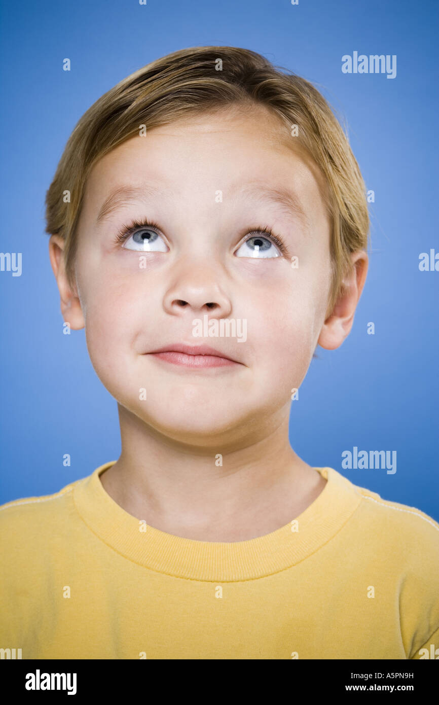 Portrait of a young boy looking up Stock Photo Alamy