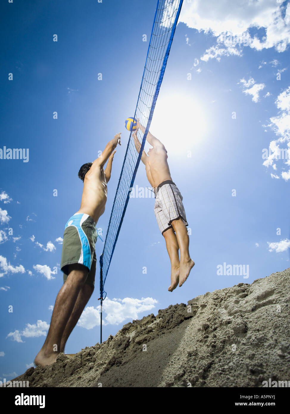 Jumping volleyball players Stock Photo - Alamy