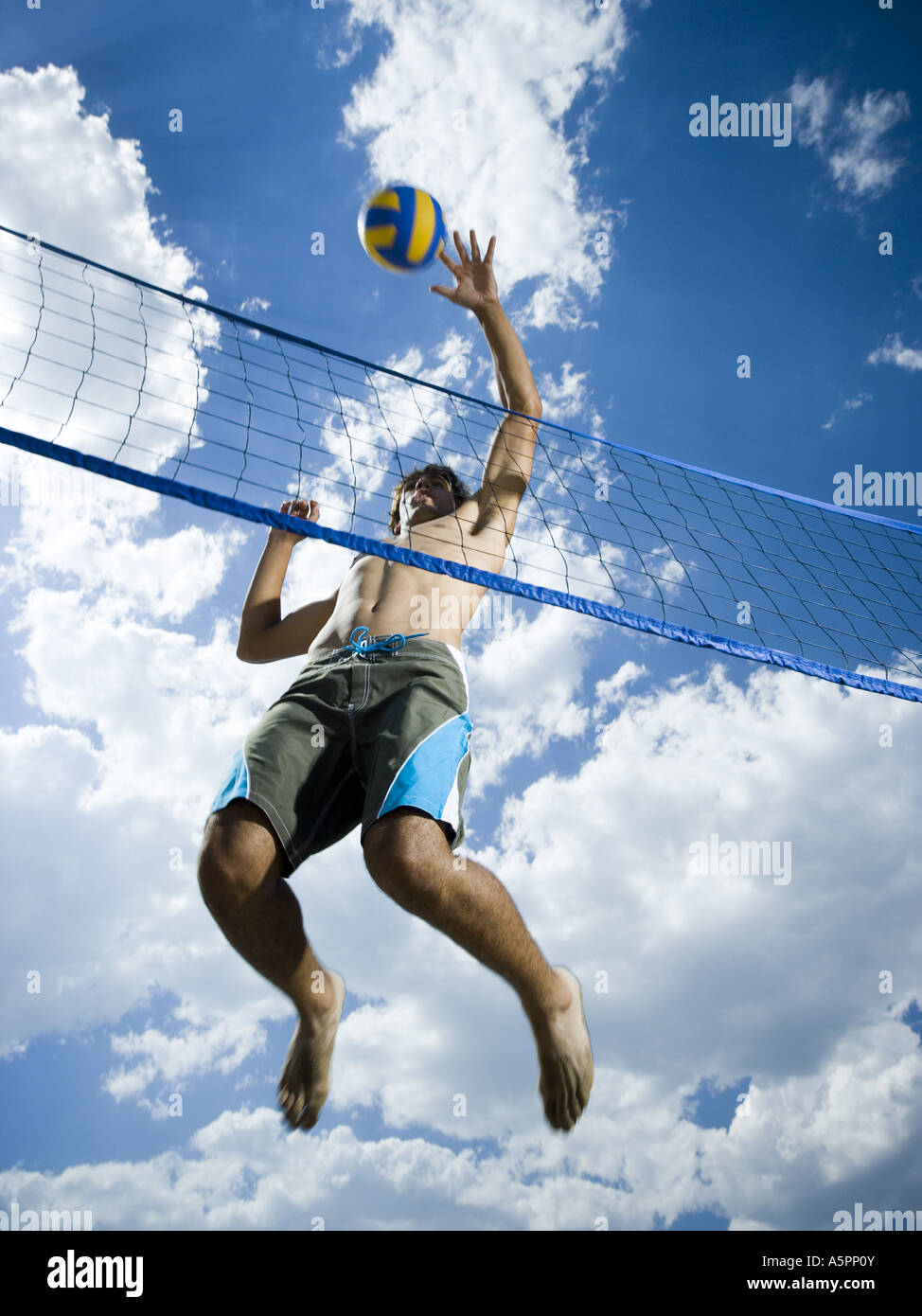 Jumping volleyball players Stock Photo Alamy