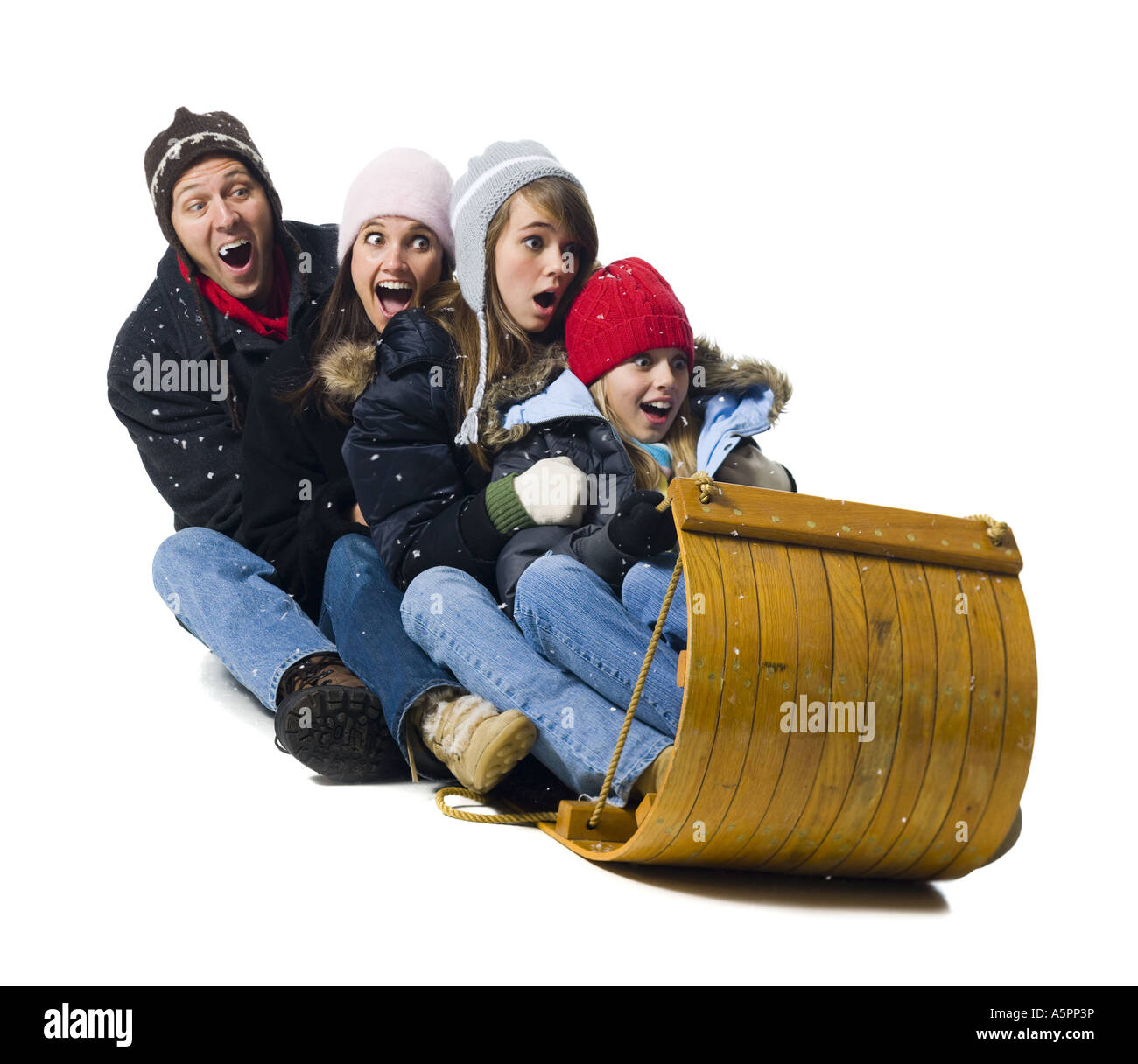 Family on toboggan Stock Photo Alamy