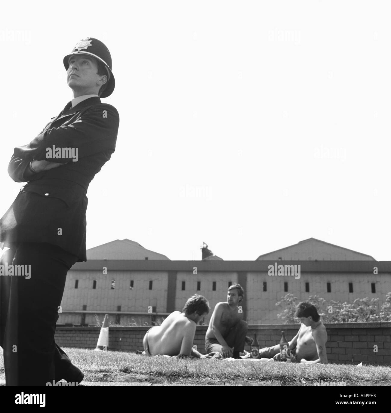 Policeman watching over striking miners from Monkwearmouth colliery picketing outside British Steel Redcar Stock Photo
