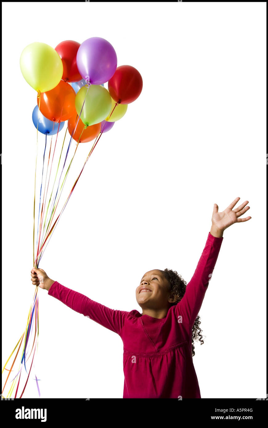 Young girl holding balloons Stock Photo Alamy