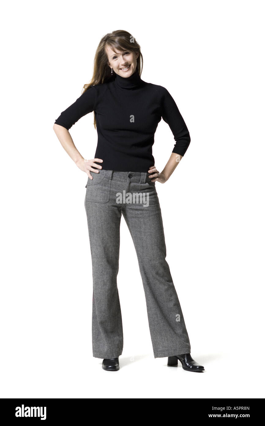 Portrait of a woman standing with her hands on her hips Stock Photo - Alamy