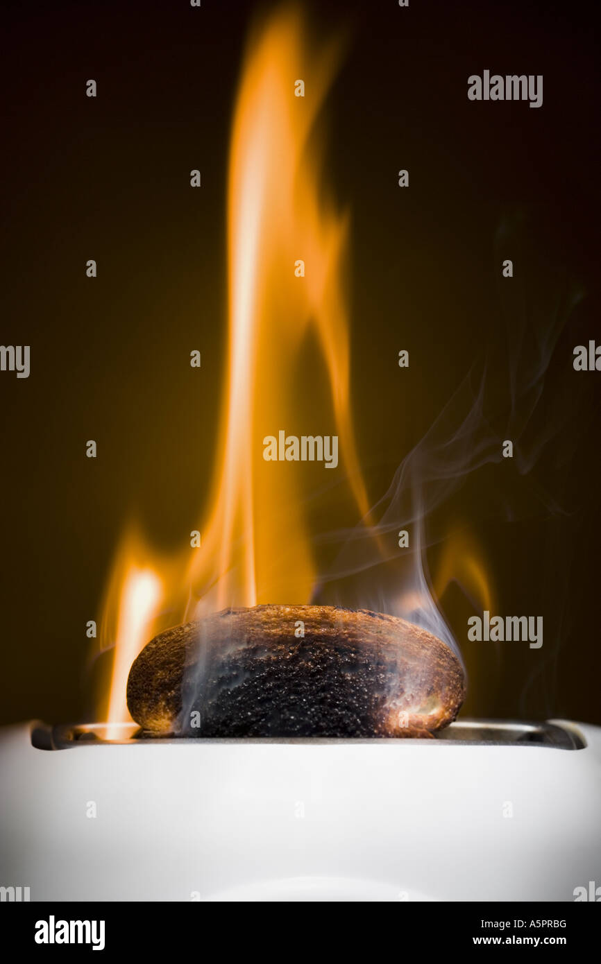 Burning toast slices in toaster Stock Photo Alamy