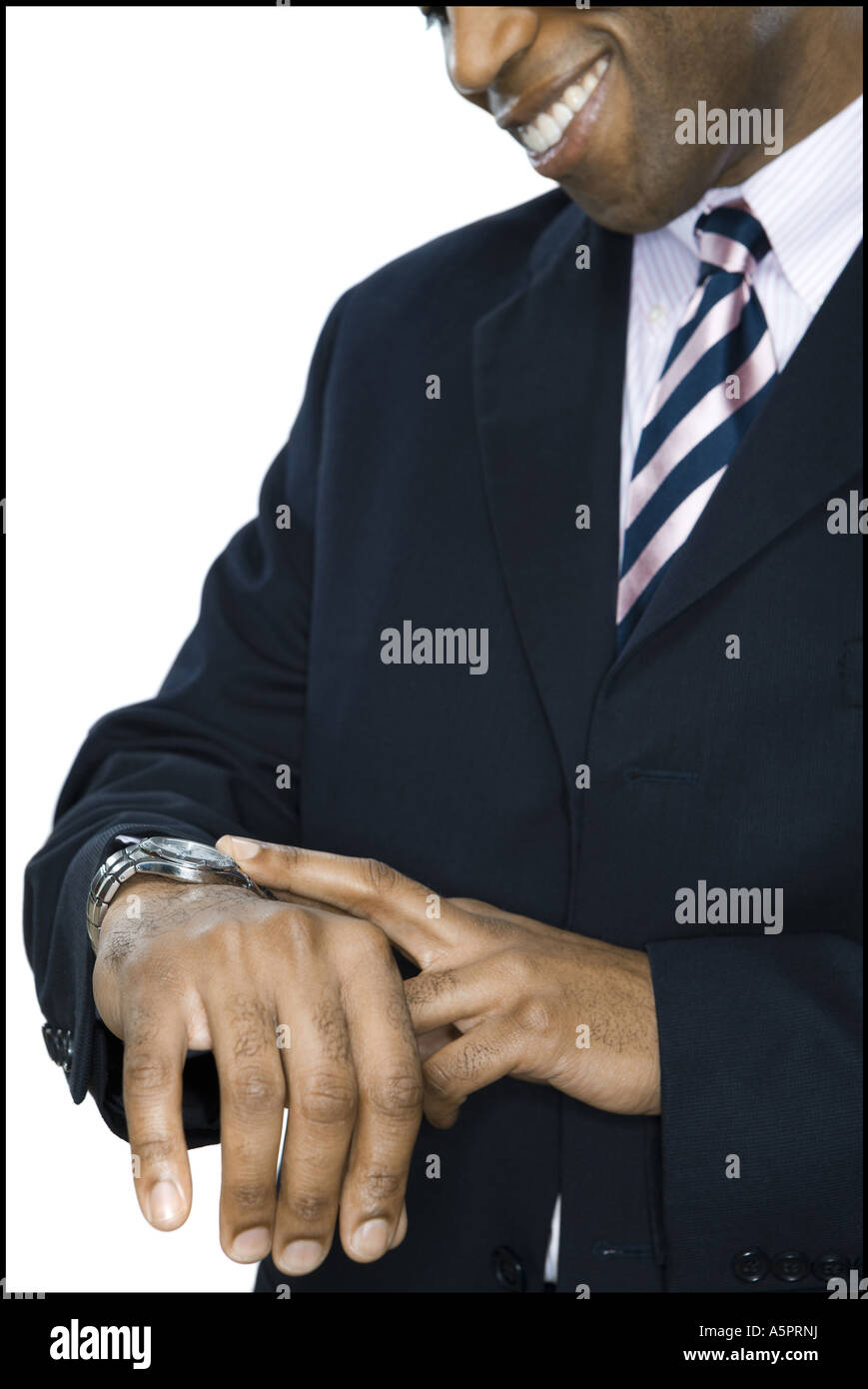 Close-up of a businessman looking at his wrist watch Stock Photo