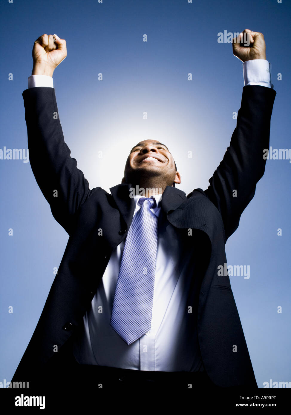 Businessman pumping fists in the air Stock Photo - Alamy