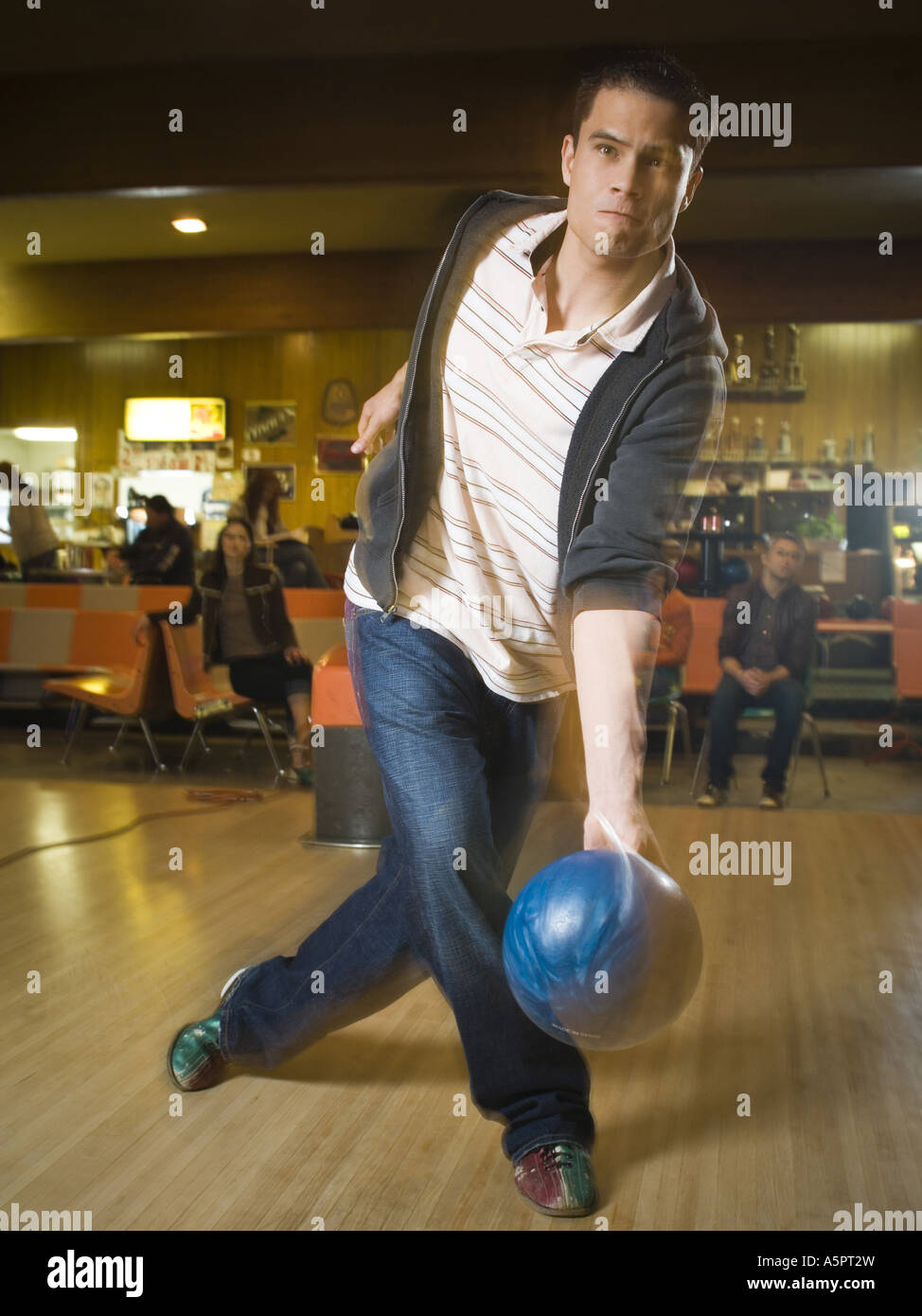Young man bowling in a bowling alley Stock Photo - Alamy