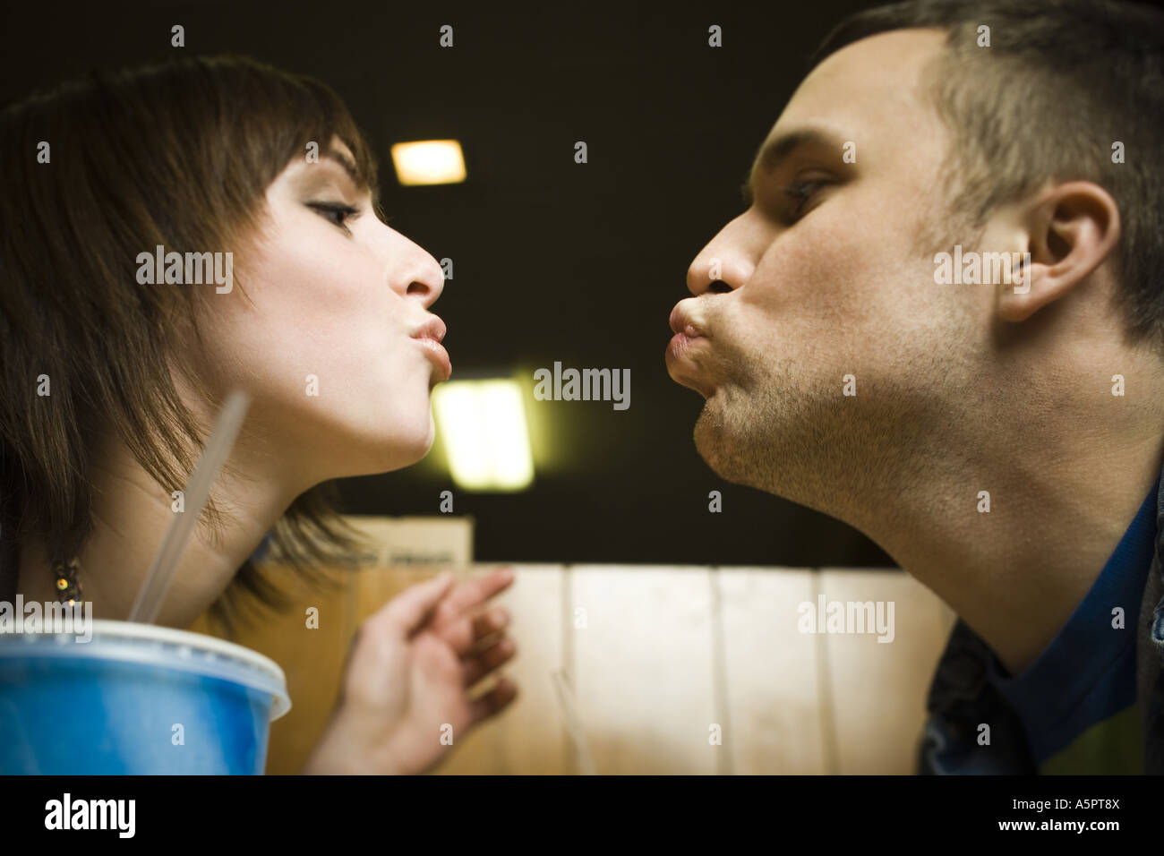 High angle view of a young man and a teenage girl sitting in a ...