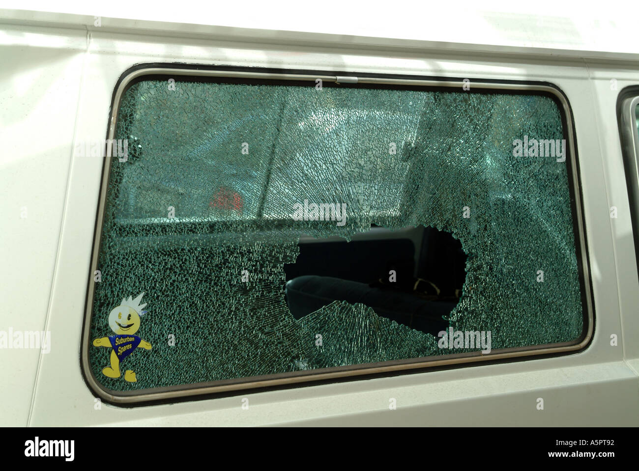 smash and grab broken window of parked car Stock Photo