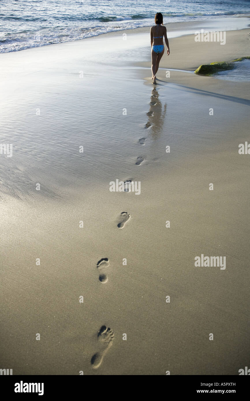 Women in bikinis walking on beach hi-res stock photography and images ...