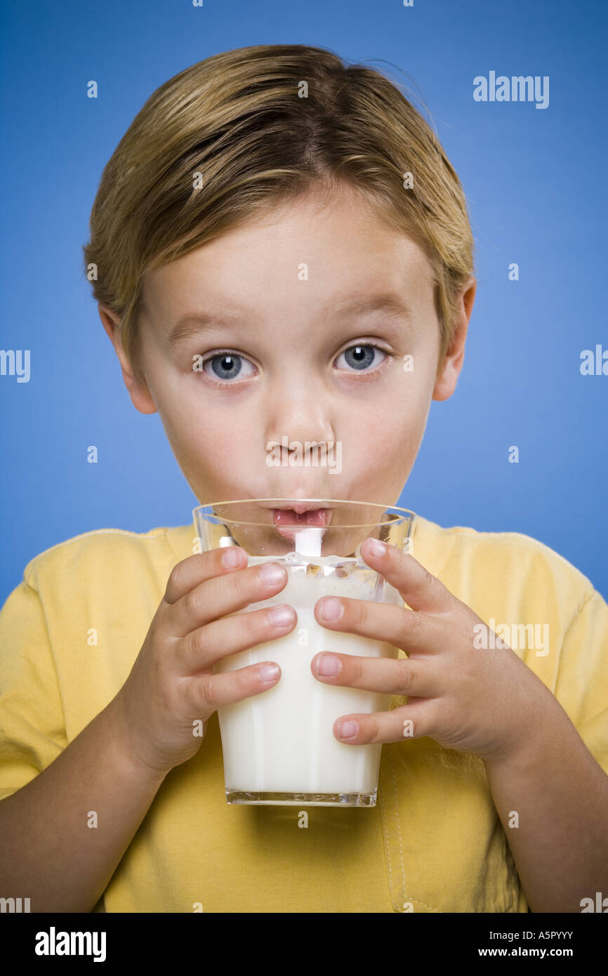 Boy drinking glass of milk Stock Photo