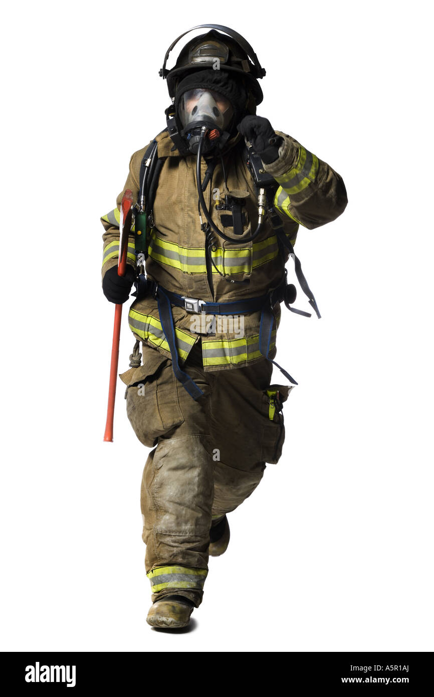 Portrait of a firefighter with mask and axe running Stock Photo
