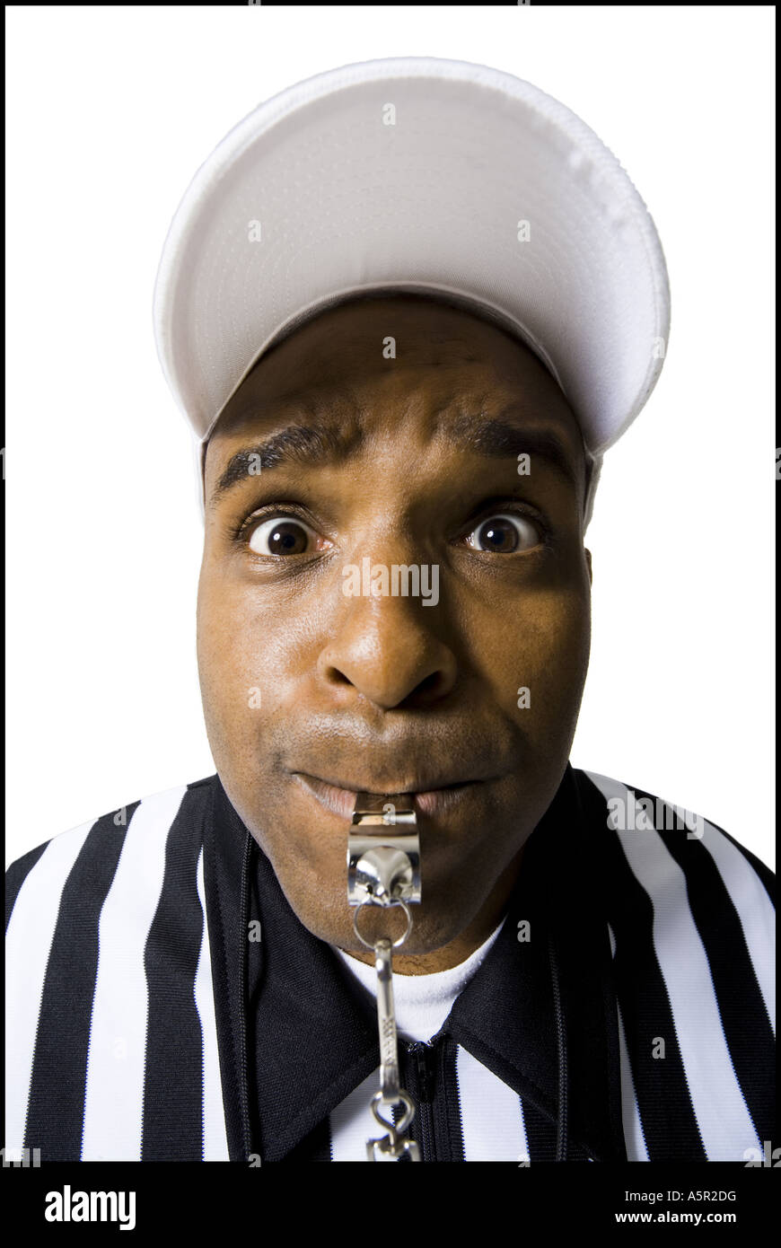 Close up of referee blowing whistle Stock Photo Alamy